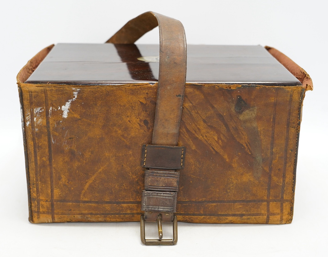 A Victorian rosewood toilet box with silver plate lidded bottles, ‘secret’ draw and leather case, 30cm wide. Condition - fair